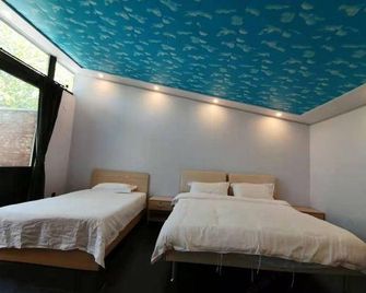 Xinshuangquan Hostel - בייג'ין - חדר שינה