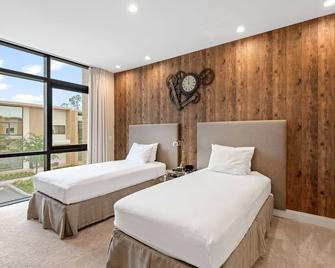 7490 Magic Village 4suites 8 guests 8 min Disney - Kissimmee - Habitación