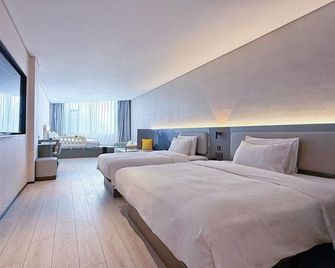 Atour Light Hotel Qingdao North Railway Station Shengping Road - צ'ינגדאו - חדר שינה