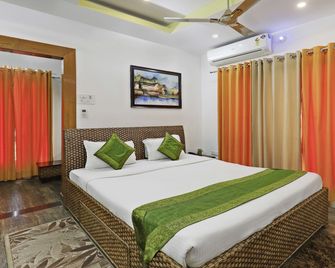 تريبو أومال هوم ستاي غانيشجوري - جواهاتي - غرفة نوم