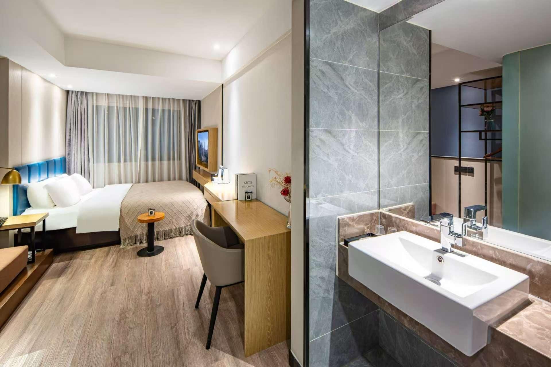 Wenrun Zhixing Holiday Hotel Nanjing Aoti Jiangdong Middle Road - נאנז'ינג - חדר שינה