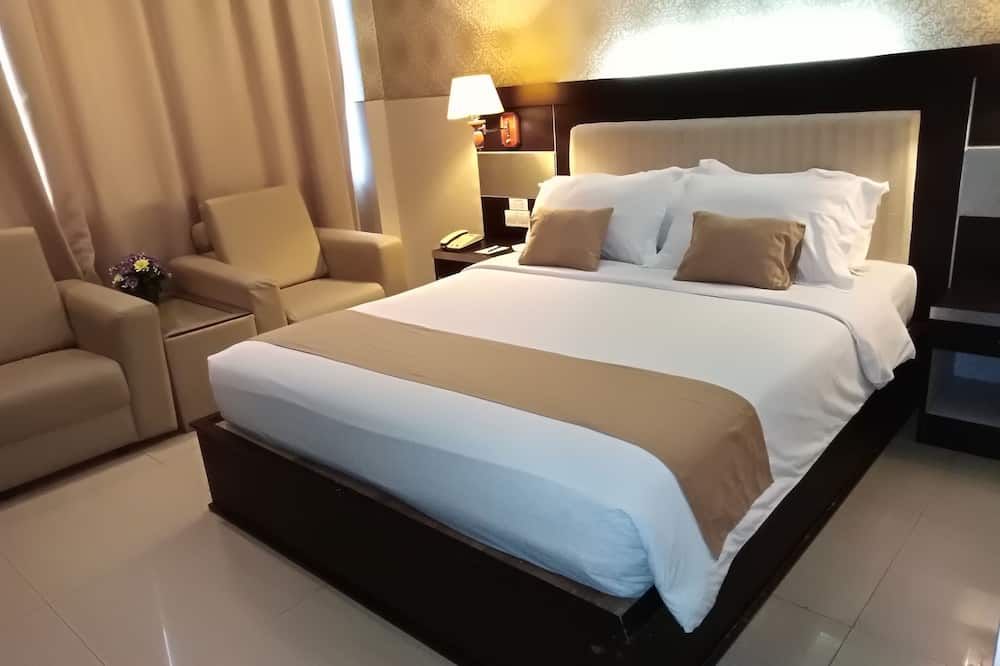 Zahra Syariah Hotel Kendari - Kendari - Schlafzimmer