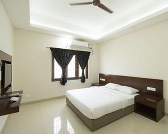 Mayfair Service Apartments - Coimbatore - Bedroom