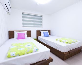 واو هيلز جيست هاوس - سيول - غرفة نوم