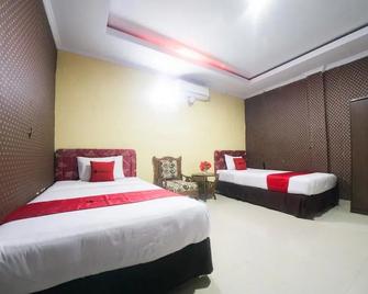 RedDoorz Syariah Near Rsud Ainun Habibie Gorontalo - Gorontalo - Bedroom