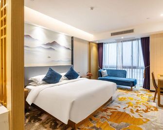 Blue City Holiday Hotel (Xiaoxian North Railway Station & Daihu Park Branch) - Suzhou - Bedroom