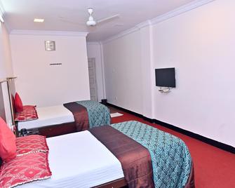 Hotel Sai Lodge - Nashik - Bedroom