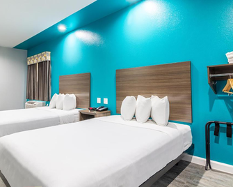 Scottish Inns & Suites - Kingwood - Humble - Schlafzimmer