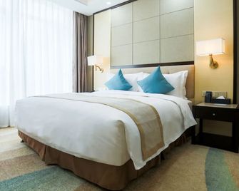 هندريد هوتل - تشينغداو - غرفة نوم