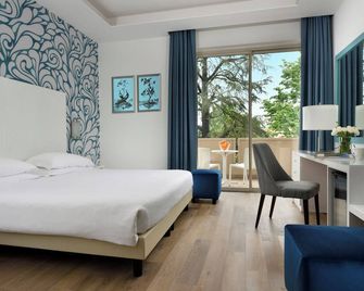 هوتل كونتينينتال ويلنس آند سبا - سيرميون - غرفة نوم