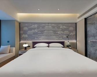 Maison New Century Hotel Jinhua Jiaheng - Jinhua - Habitación