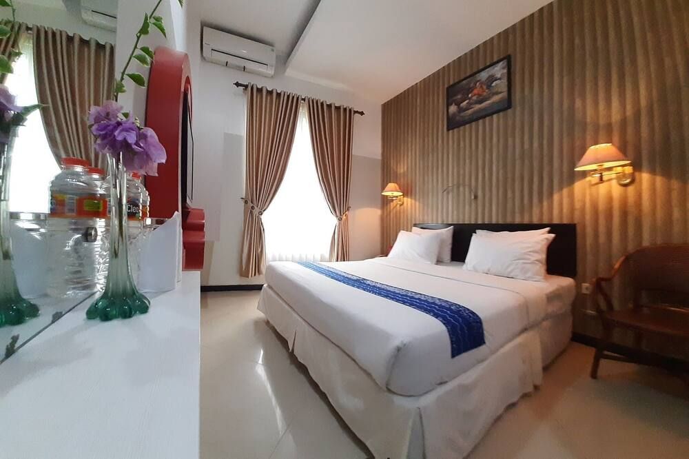 Queen City Hotel - Банджармасін - Спальня