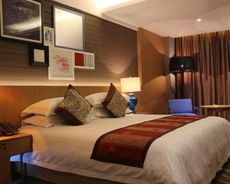 Family Tianzhongxing Hotel Zhumadian - Zhumadian - Bedroom