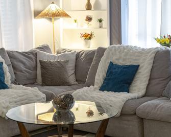 Cozy single family home overflowing with Southern charm and modern appeal. - McComb - Living room