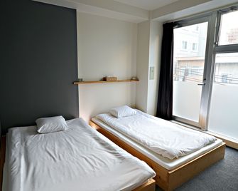 سانتياجو جست هاوس هيروشيما - هوستل - هيروشيما - غرفة نوم