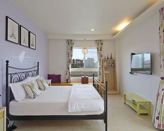 Jin Zhu Ya Homestay - Wujie Township - Slaapkamer