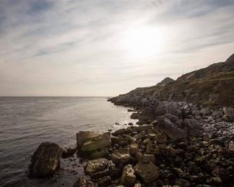 Coastal cottage , historic and award winning, absolute ocean front rural glens - Cushendall - Beach