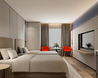 هوليداي إن إكسبرس هاربين سنترال أفينيو باي آيتش جي - هاربين - غرفة نوم