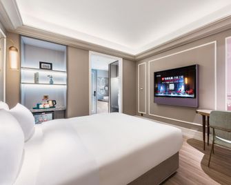 Manxin Hotel Jinan West Railway Station - Jinan - Schlafzimmer