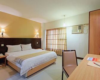 The Orchard Cebu Hotel & Suites powered by Cocotel - Mandaue City - Bedroom