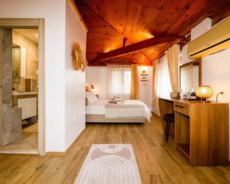 Oase Garden Hotel - Чіралі - Спальня