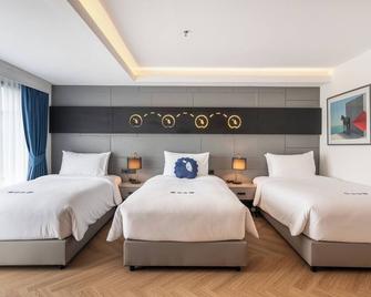 Kokotel Chiang Rai Airport Suites - Chiang Rai - Bedroom