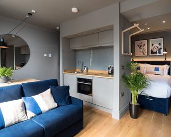 Hiding Space - Trim Street Apartments - Bath - Living room