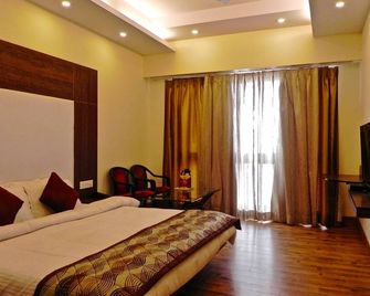 هوتل مول بالاس - موسوري - غرفة نوم