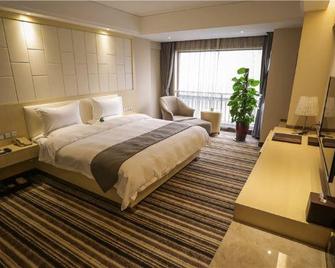 Cygnus International Hotel - Luoyang - Bedroom
