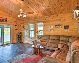Sun-dappled Cadillac Gem w/ Kayaks & Grill! - Cadillac - Living room