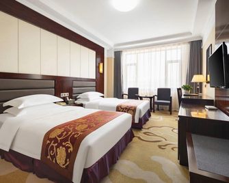 Huanren Longxing International Hotel - Tonghua - Bedroom