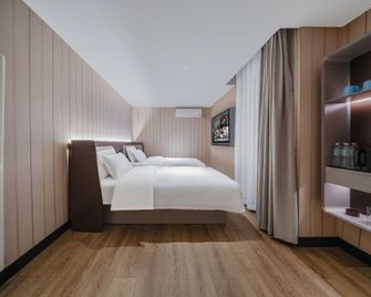 Hanting Hotel Qingdao Licang Jinshui Road - Qingdao - Habitación