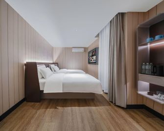 Hanting Hotel Qingdao Licang Jinshui Road - צ'ינגדאו - חדר שינה