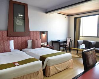 BP Grand Tower Hotel - Hat Yai - Phòng ngủ