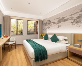Floral Hotel She Hetang Yue Se Homestay - Shaoxing - Soveværelse
