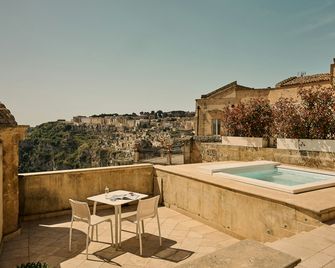 Palazzo Gattini Luxury Hotel - מאטרה - חדר שינה