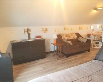 The loft, efficiency suite offering privacy and comfort. - Essexville - Living room