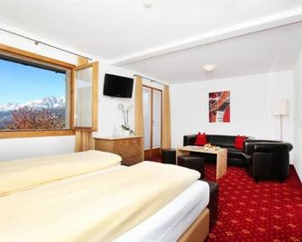 Hotel Central - Obersaxen Mundaun - Camera da letto