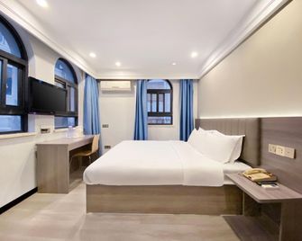 7 Days Inn Emei Haochijie Branch - Leshan - Bedroom