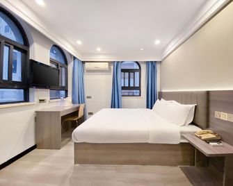 7 Days Inn Emei Haochijie Branch - Leshan - Bedroom