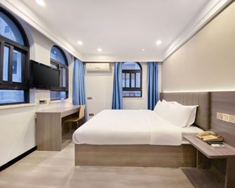 7 Days Inn Emei Haochijie Branch - Leshan - Camera da letto