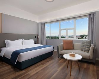 Ramada Encore by Wyndham Qingdao Shinan - Qingdao - Habitación