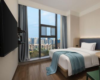 Mini Youjia Hotel (Ganzhou Economic Development Zone, Gannan Science and Technology College Branch) - Ganzhou - Bedroom