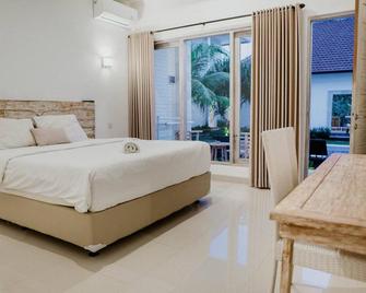 Berawa Dini Guesthouse - Denpasar - Bedroom