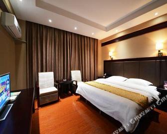 Jinzhiyuan Hotel - Dehong - Quarto