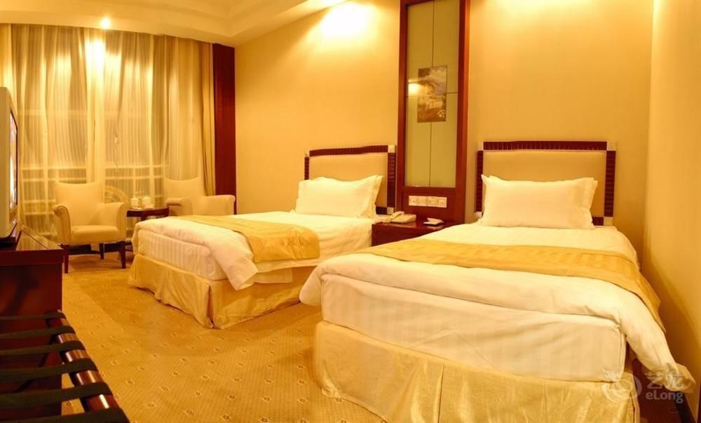 Inner Mongolia Huachen Hotel - هوهيهوت - غرفة نوم