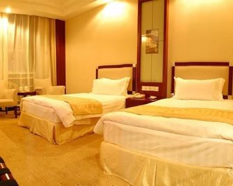 Inner Mongolia Huachen Hotel - هوهيهوت - غرفة نوم