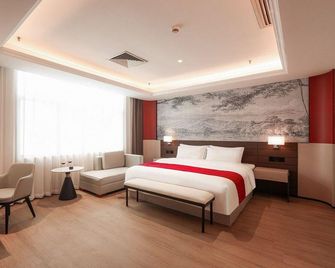 Rezen Anyi Hotel (Guangzhou Baiyun Railway Station) - Guangzhou - Bedroom