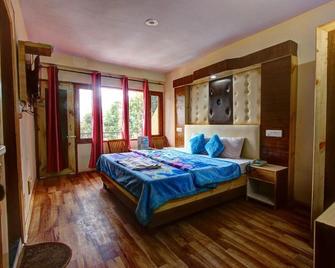 Hotel Solitaire Manali - Manali - Schlafzimmer