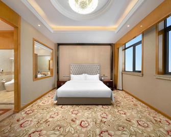 Wanda Spring Business Hotel (Daqing Sa'ertu Wanda Plaza) - Daqing - Schlafzimmer